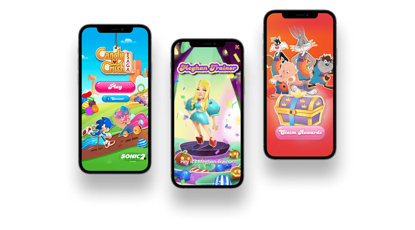 Three iphones. Left shows Candy Crush opening screen with Sonic 2, middle show Meghan Trainer Candy Crush screen, right shows Looney Tunes Space Jam character with "claim awards" button.